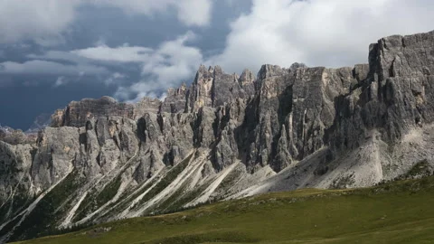 4K Timelapse of clouds rolling over rugged mountains Stock Footage 138173704
