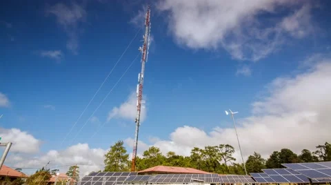 4K Timelapse, cloudscape the solar panels and wind turbine with blue sky. Stock Footage 61097614