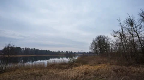 4k Timelapse of cloudy sky over lake at autumn. Stock Footage 60063661