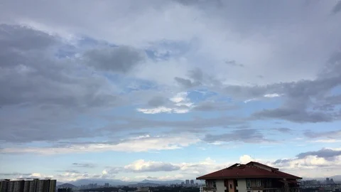 4K timelapse of cloudy sky top of rooftop. Stock Footage 101422064