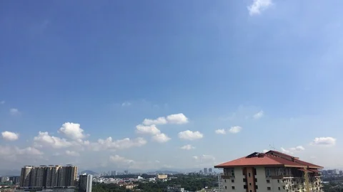 4K timelapse of cloudy sky top of rooftop. Stock Footage 101422104