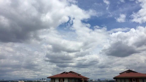4K timelapse of cloudy sky top of rooftop. Stock Footage 101562234