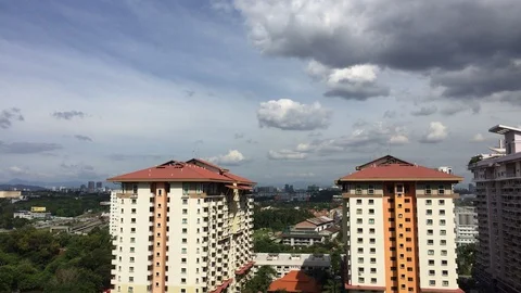 4K timelapse of cloudy sky on top of rooftop. Stock Footage 101735589