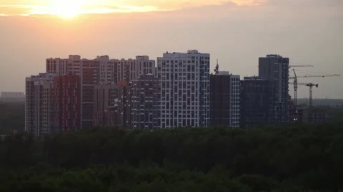 4K timelapse of the construction cranes and buildings at sunset. Stock Footage 234823341