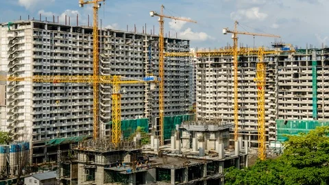4k timelapse of construction site. Cranes working on construct building Stock Footage 104878535