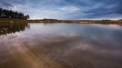 4k Timelapse of dark clouds over small lake Vídeos de archivo 68956126