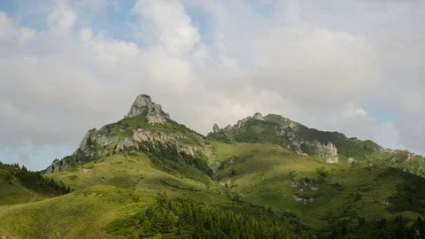 4k timelapse of dynamic grey clouds over cliffs in Ciucas Mountains. Stock Footage 77483559
