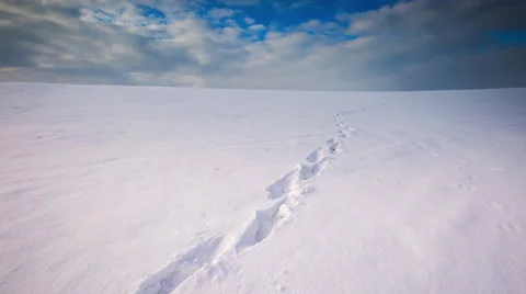 4k timelapse of empty snow field with human footprints at winter Stock Footage 60224421