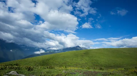 4k timelapse of fast moving clouds above beautiful high mountain grassland, with Stock Footage 66184815