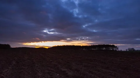 4k timelapse of field under cloudy sky after sunset. Stock Footage 60193628