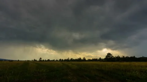 4k timelapse flat landscape and very dark rain clouds on the sky Stock Footage 165438766
