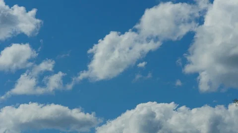 4K Timelapse - Fluffy Clouds Blue Sky Stock Footage 128936713