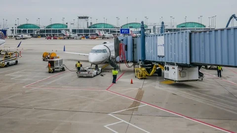 4k timelapse of ground crew prepare a plane for take  small US airport Stock Footage 105552955