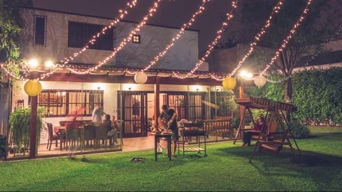 4K Timelapse of group of friends making barbecue in the backyard at dinner time Stock Footage 84019474