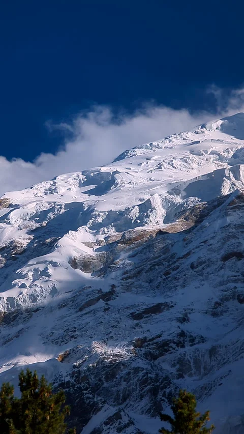 4K Timelapse of Haramosh Peak | Snow-Capped Mountain with Rolling Clouds Stock Footage 303662996