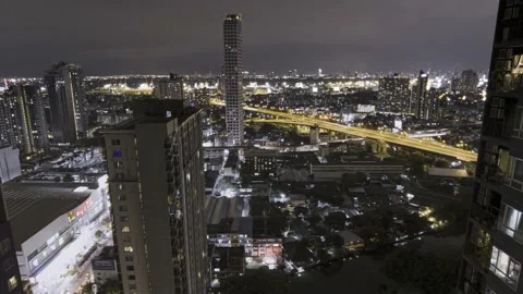 4k Timelapse of heavy storm and lighting in Bangkok showing night traffic, MRT Stock Footage 227467147