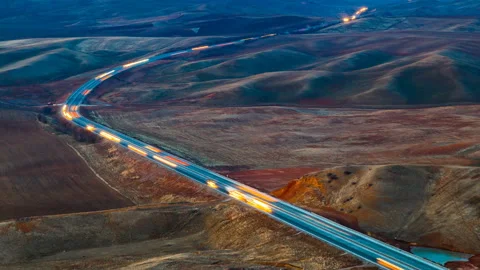 4K Timelapse. High-speed traffic of cars along the road, in the mountains in the Stock Footage 85935198