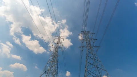 4K Timelapse of high voltage post.High-voltage tower sky background Stock Footage 119873580