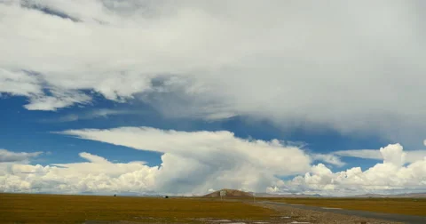 4k timelapse huge clouds rolling over tibet namtso,cars traveling on the road. Stock Footage 45533446