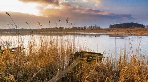 4k timelapse of lake at evening in springtime Stock Footage 60825309