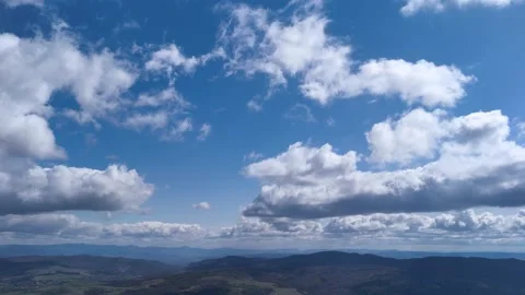 4k Timelapse of Majestic clouds shining through the colorful blue sky Stock Footage 201488753