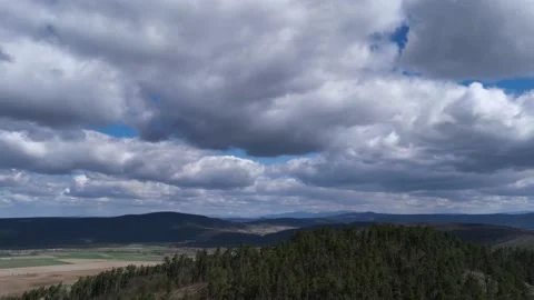 4k Timelapse of Majestic clouds shining through the colorful blue sky Stock Footage 201488955