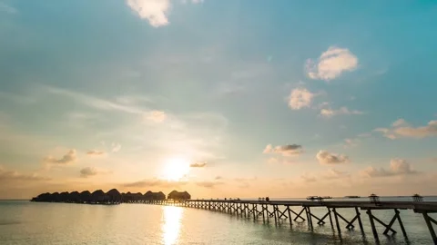 4K Timelapse, Maldives sunset clouds moving over the jetty Stock Footage 130433387