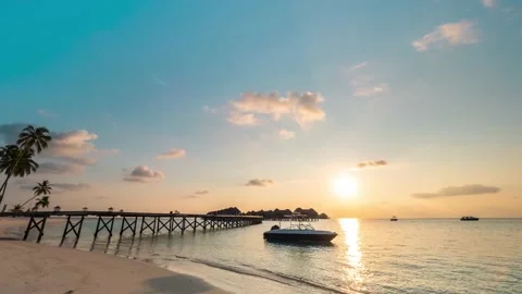 4K Timelapse, Maldives sunset over the jetty from beach Stock Footage 130433573
