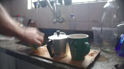 A 4k timelapse of a man doing dishwashing in his kitchen Stock Footage 131467077