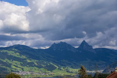 4k timelapse of mountains with dramatic sky, Switzerland Stock Footage 255801344