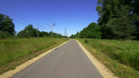 4K - Timelapse of a moving on a bike path through a field Video stock 205701955