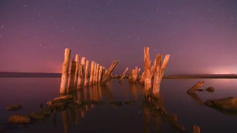4k Timelapse of Night at the ocean water Moving stars and clouds above the poles Stock Footage 220086210