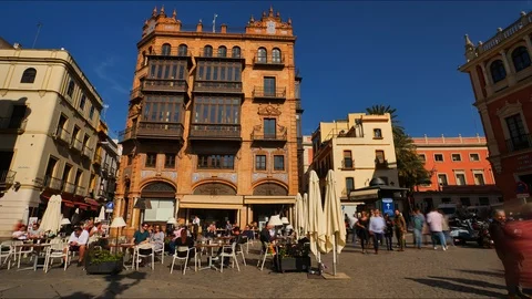 4K Timelapse of people enjoy tapas and coffee in Plaza San Francisco in Seville. Stock Footage 125724653