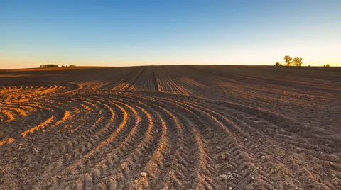 4k timelapse of plowed field at evening. Stock Footage 58957459