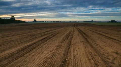 4k timelapse of plowed field at morning Stock Footage 59078775