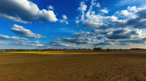 4k timelapse of plowed field at spring afternoon in good light Stock Footage 62287716