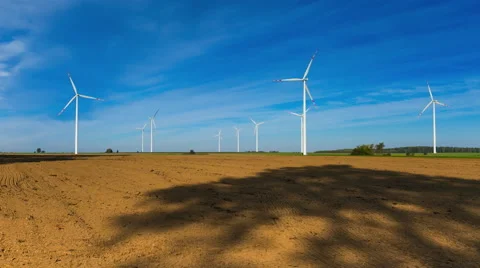 4k timelapse of plowed fields and wind farm Video stock 58956794
