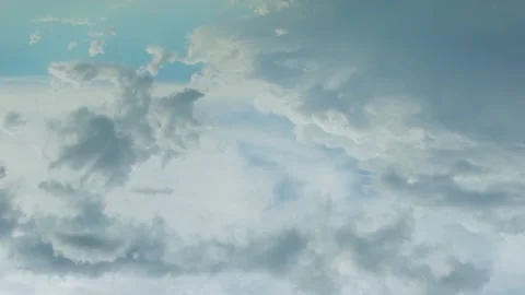 4K Timelapse of Plump Cumulus Gray and White Clouds in a Blue Sky. Aerial Drone  Stock Footage 234502936