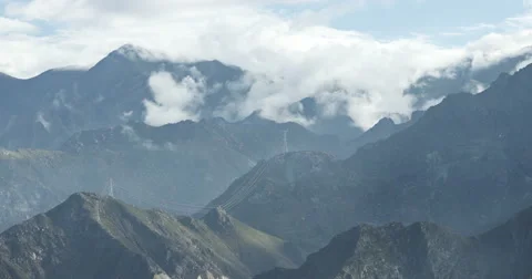 4k timelapse puffy clouds mass rolling over Tibet mountaintop,roof of the World Stock Footage 44662279