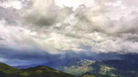 4K timelapse of rain clouds billowing over beautiful mountain landscape Stock Footage 38242279