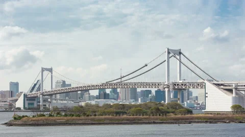 4K Timelapse of Rainbow Bridge and Tokyo skyline in background with cloudy 動画素材 64660893