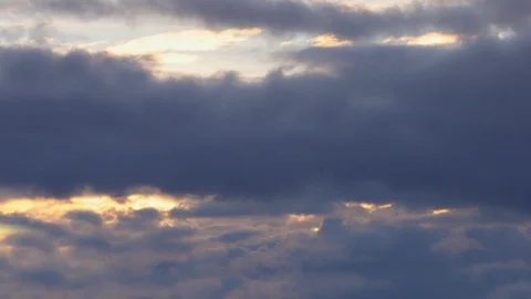 4K Timelapse. Rapidly passing puffy fluffy blue clouds, background. Ultra HD Stock Footage 106015440