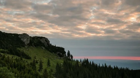 4k timelapse of red dynamic clouds at sunrise in Ceahlau Mountains. Stock Footage 77140240