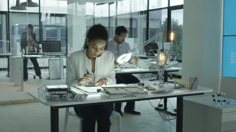 4K Timelapse research engineers working in lab building electronics &amp; robotics.  Stock Footage 66414918