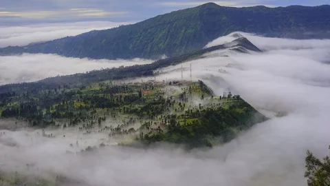 4K TIMELAPSE OF ROLLING CLOUD OVER CEMORO LAWANG VILLAGE, BROMO. Stock Footage 117285838