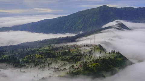 4K TIMELAPSE OF ROLLING CLOUD OVER CEMORO LAWANG VILLAGE, BROMO. Stock Footage 117285899