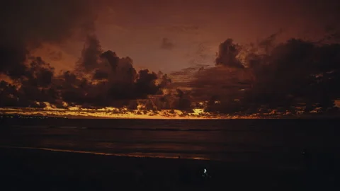 4K timelapse romantic couple under dramatic sunset with clouds over ocean, Bali Stock Footage 264748496