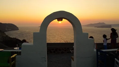 4K Timelapse: Setting sun reflects sunbeams in the sea and shines through clouds Stock Footage 107379336