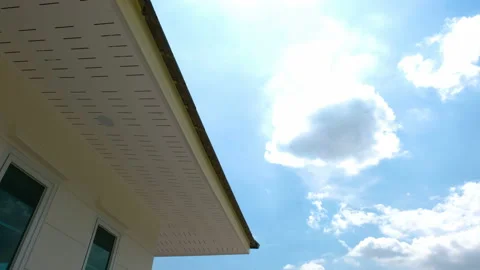 4K TimeLapse sky with clouds over the houses Stock Footage 153610449