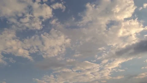 4k timelapse of the sky entering at sunset. Blue sky with golden clouds Stock Footage 159687172
